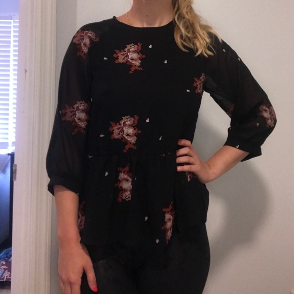 Black patterned peplum top. - Picture 2 of 2